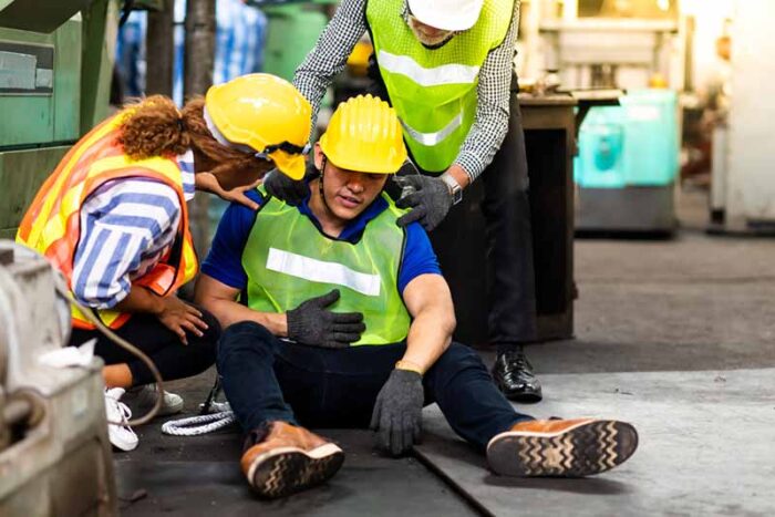 employee helping an injured worker