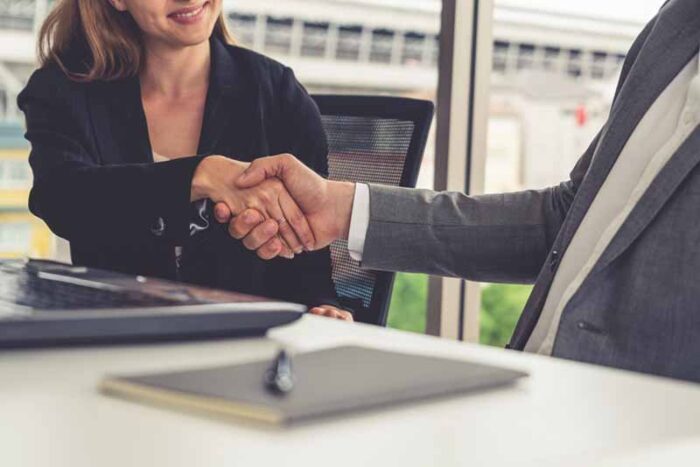 lawyer shaking hands with a client