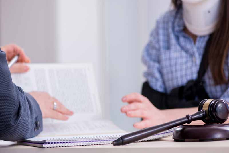 Injured employee talking with lawyer