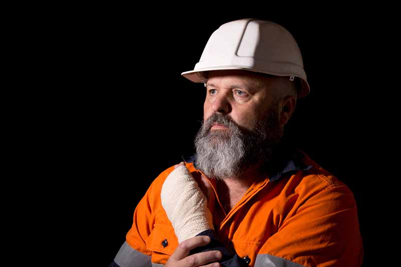 A male worker with a hand injury